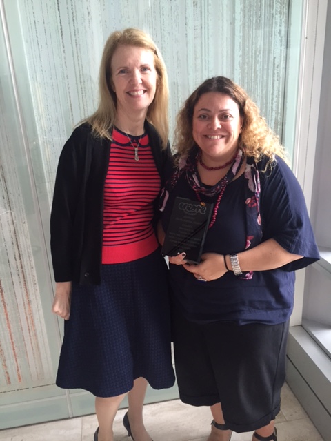 Cathy Carnovale receiving the award for the VIC team