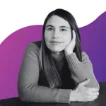 A photo of a woman with long hair, smiling